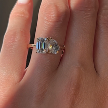 Load image into Gallery viewer, Close-Up of Emerald and Pear Moissanite Ring under Natural Light