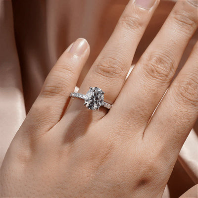 Oval Moissanite Engagement Ring with Micropavé Band on Hand