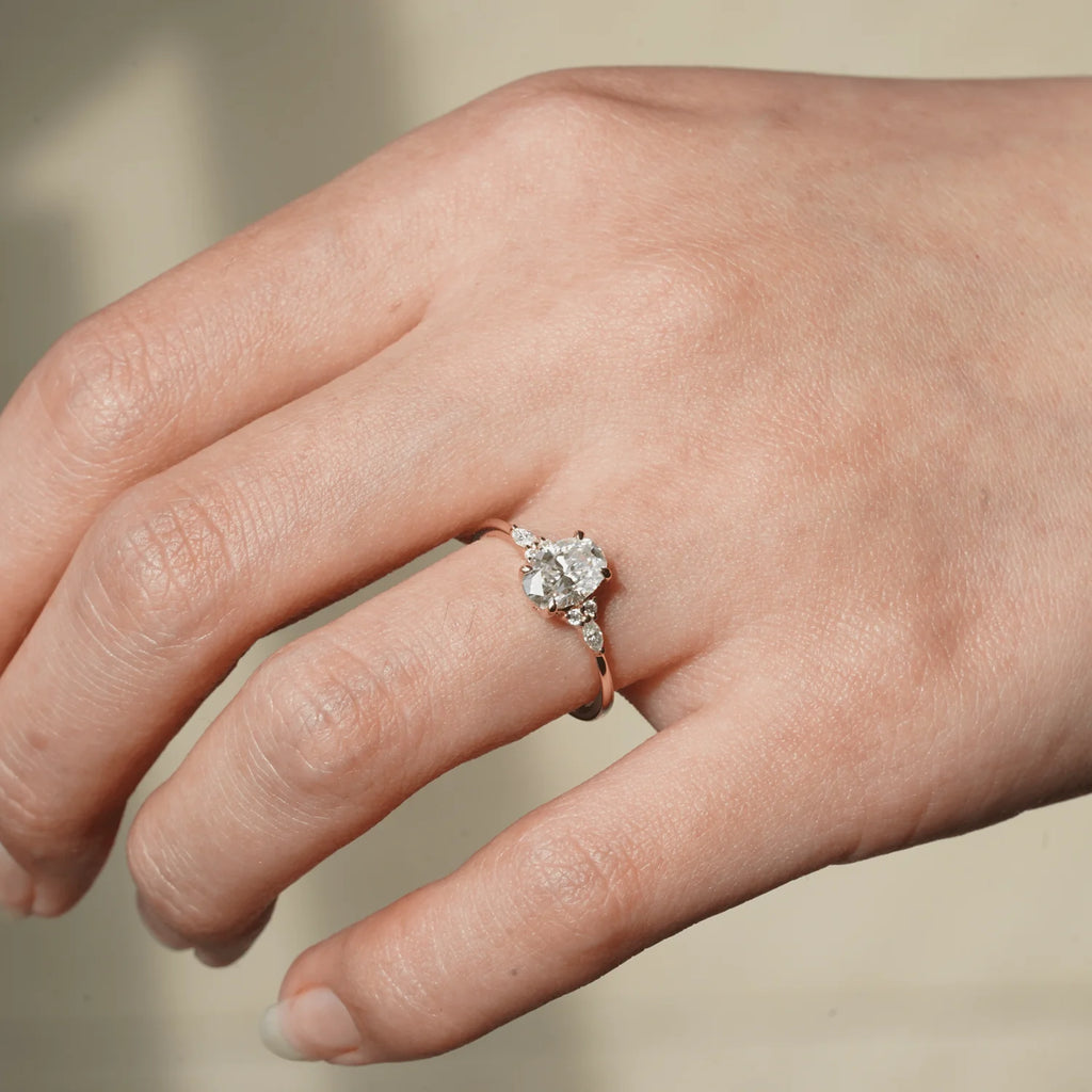 Petite Oval Moissanite Engagement Ring with Accent Stones | TKEANAAL